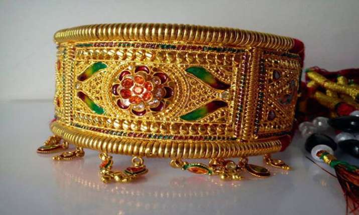 Gold slides by Rs 130 on muted demand, weak global cues Gold slides by Rs 130 on muted demand, weak global cues- India TV Paisa