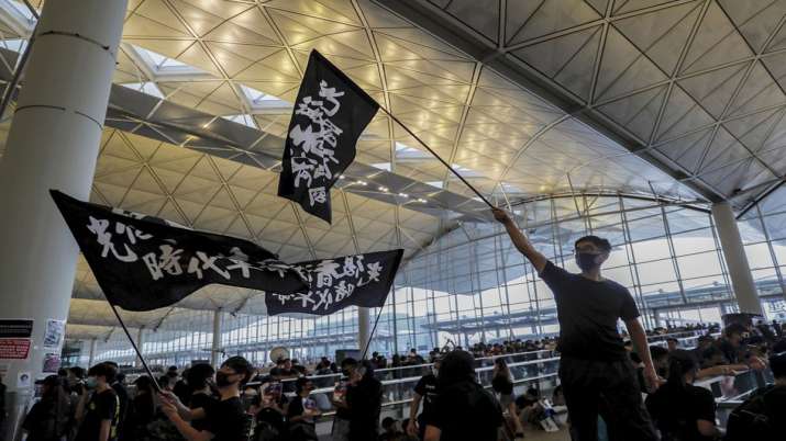 Hong Kong airport shuts down amid pro-democracy protest Hong Kong airport shuts down amid pro-democracy protest- India TV