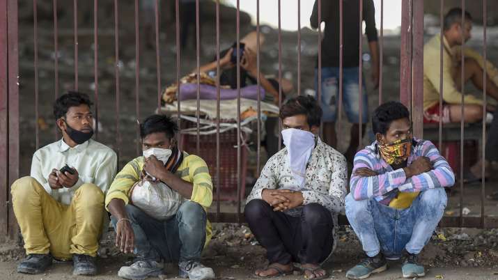 Stranded migrant workers take shelter under a flyover in Mumbai. Stranded migrant workers take shelter under a flyover in Mumbai.- India TV Hindi