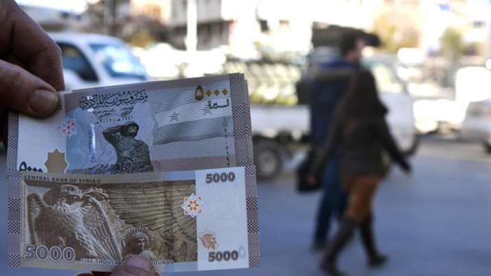 Syria issues new banknote to cope with inflation Syria issues new banknote to cope with inflation- India TV Paisa