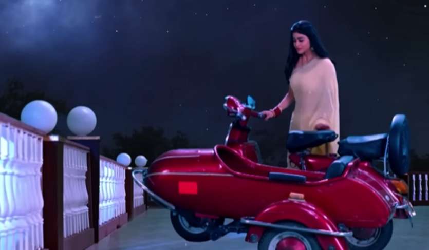 In the scene of 'Naagamini', she is shown riding a scooter and landing on the moon to save her husband.