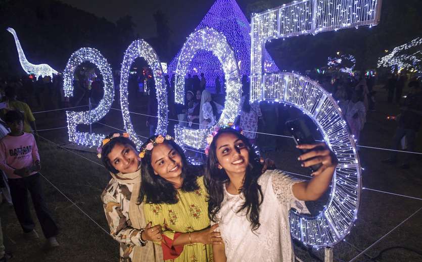 People celebrating New Year at the decorated Mananchira Square in Kozhikode, Kerala. During this time, people clicked a lot of selfies on the first day of the New Year.