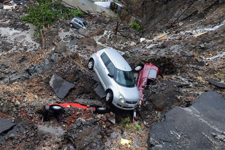 Mumbai Rains: Cars buried as wall collapses after heavy rain, trains services disrupted | PTI Mumbai Rains: Cars buried as wall collapses after heavy rain, trains services disrupted | PTI- India TV Hindi