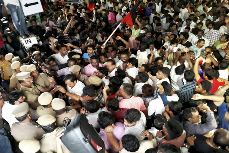 DMK supporters wait outside a private hospital, where... DMK supporters wait outside a private hospital, where...- India TV Hindi