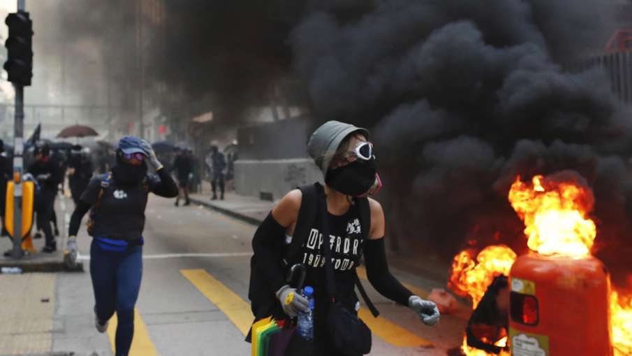 Hong Kong police slammed in fresh protests over shooting of teenage boy | AP Hong Kong police slammed in fresh protests over shooting of teenage boy | AP- India TV Hindi