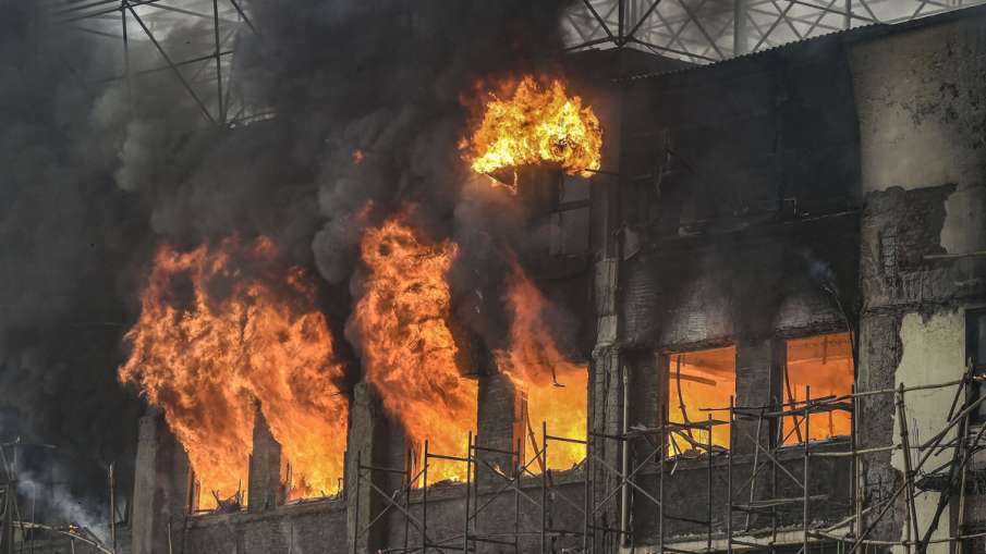 Smoke and flames billow out from the GST Bhavan after a... Smoke and flames billow out from the GST Bhavan after a...- India TV Hindi