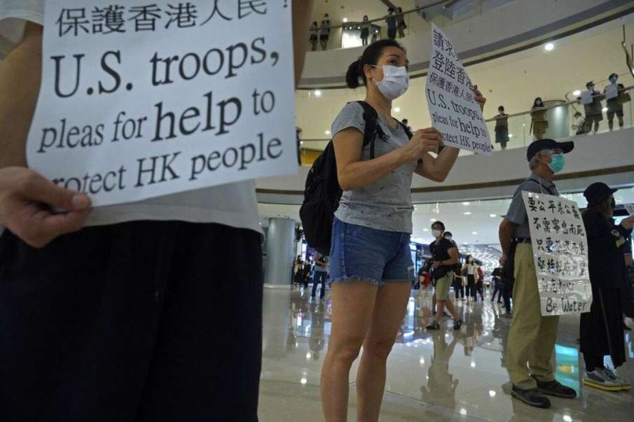 Hong Kong security law: Four students arrested for 'inciting secession' Hong Kong security law: Four students arrested for 'inciting secession'- India TV Hindi