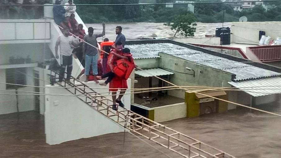 Rains batter Rajkot, Jamnagar in Guj; Over 200 people rescued, 7,000 shifted to safer places Rains batter Rajkot, Jamnagar in Guj; Over 200 people rescued, 7,000 shifted to safer places- India TV Hindi