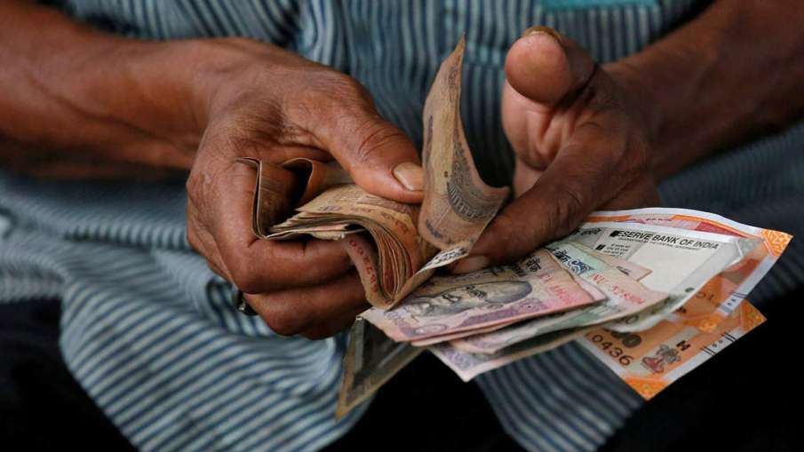 Rupee tanks 95 paise, falls below 76 level against US dollar amid coronavirus scare- India TV Hindi News