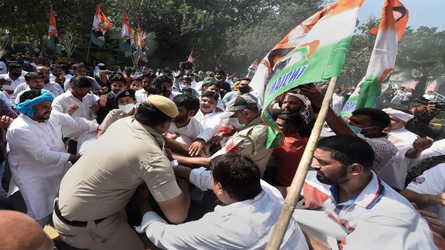 Police personnel stop Indian Youth Congress members who were staging a protest demanding the immedia- India TV Hindi