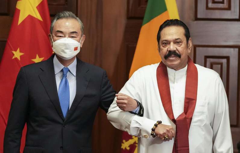 Wang Yi and Mahinda Rajapaksa- India TV Hindi