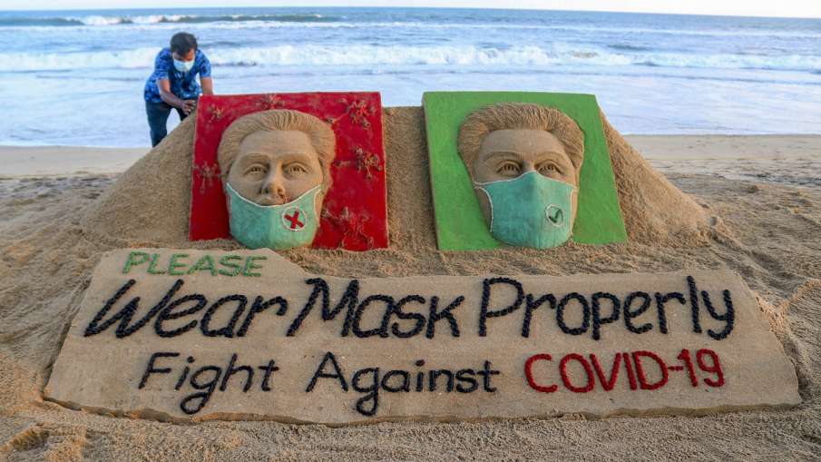Puri: Artist Sudarsan Pattnaik makes a sand sculpture with a message Wear Mask Properly (Representat- India TV Hindi